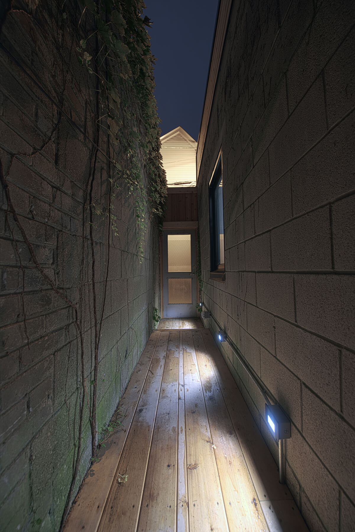 Exterior Corridor at Night - Sustainable Residential New Build Toronto